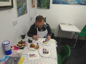 Our very own judge - Counsellor Matt Stanley judging the best cake competition 